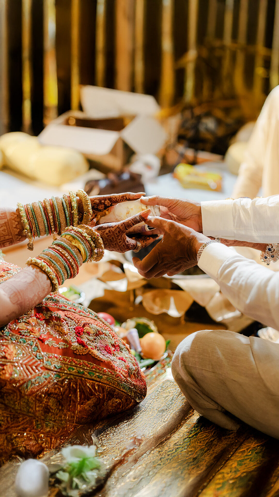 A groom giving shankh to brie doing indian wedding ritual